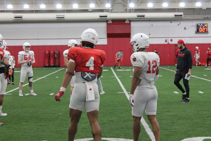 Markus Alen and Max Lofy talking after a special team's rep in spring practice.